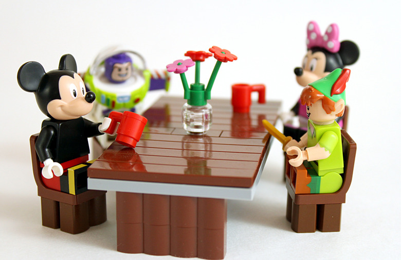 Lego Mickey, Minnie, Buzz Lightyear, and Peter Pan having a drink